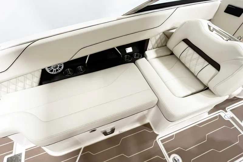 Slide: The Image of Luxurious interior seating of 2025 Regal LX6 boat with elegant white upholstery. - 14
