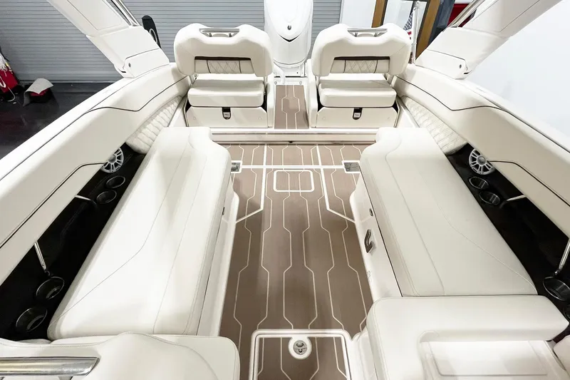 Slide: The Image of Luxurious interior of 2025 Regal LX6 boat with white seating and modern design. - 8
