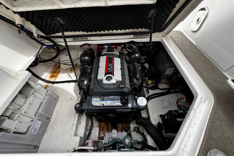 Slide: The Image of Engine compartment of a 2016 Sea Ray Sundancer 260 boat, featuring a 6.2L engine. - 14