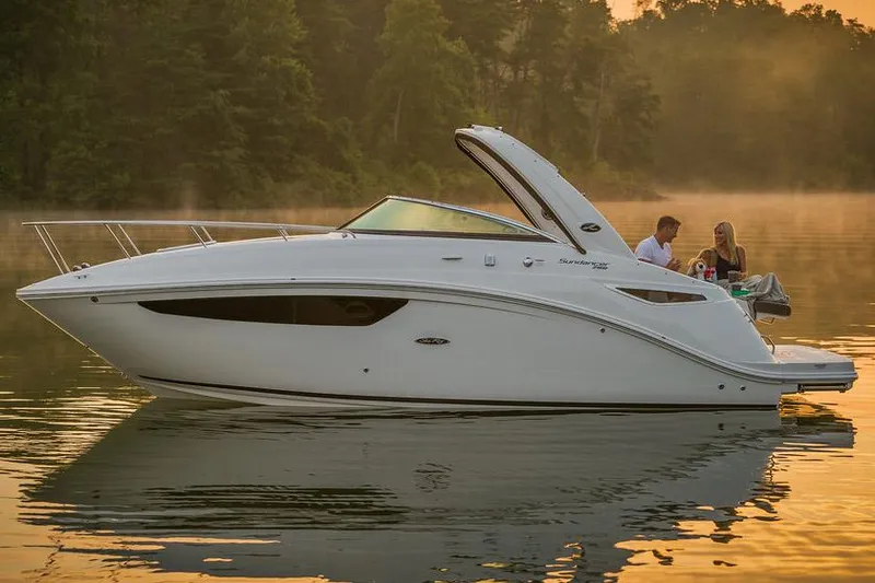 Slide: The Image of Manufacturer Provided Image: 2016 Sea Ray 260 Sundancer boat on a serene lake at sunset. - 2