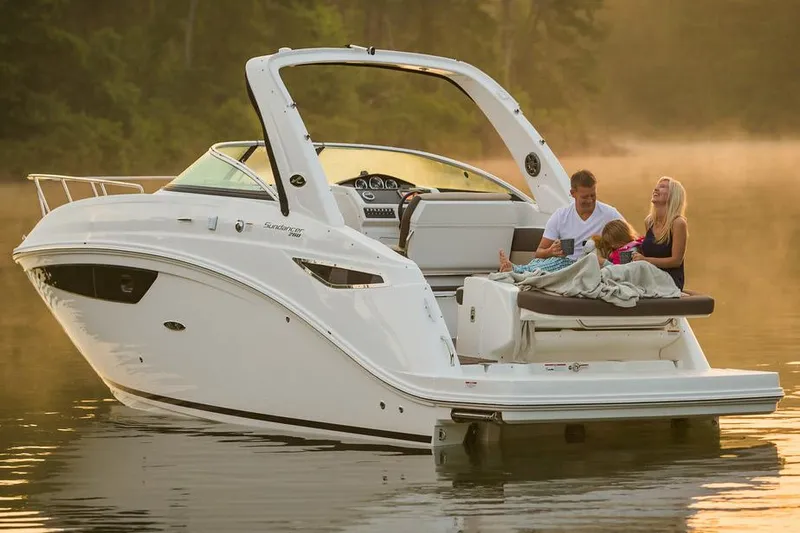 Slide: The Image of Manufacturer Provided Image: 2016 Sea Ray 260 Sundancer boat with people relaxing on deck in serene waters. - 3