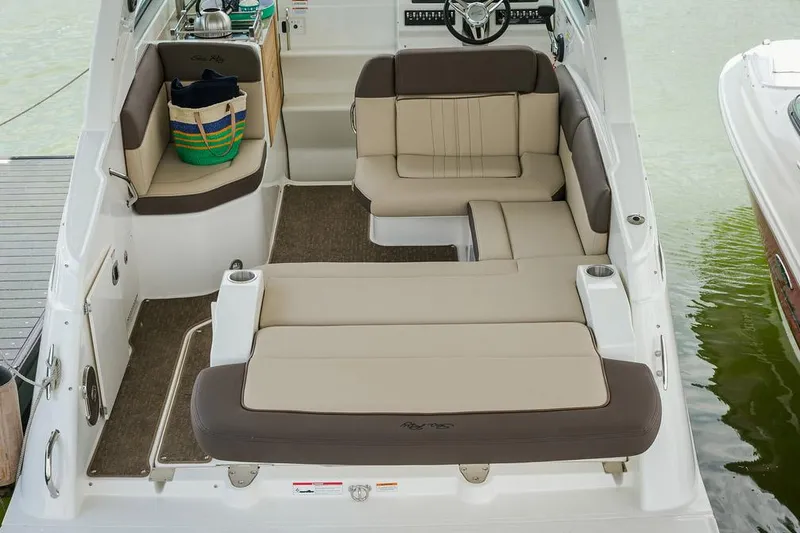 Slide: The Image of Manufacturer Provided Image: 2016 Sea Ray 260 Sundancer boat interior with beige and brown seating. - 7