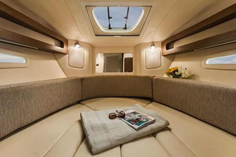 Slide: The Image of Manufacturer Provided Image: Interior cabin of 2016 Sea Ray 260 Sundancer with skylight and cozy seating. - 8