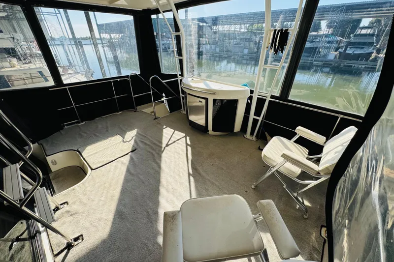 Slide: The Image of Interior view of 1995 Bayliner 4587 Motoryacht with seating and water views. - 12