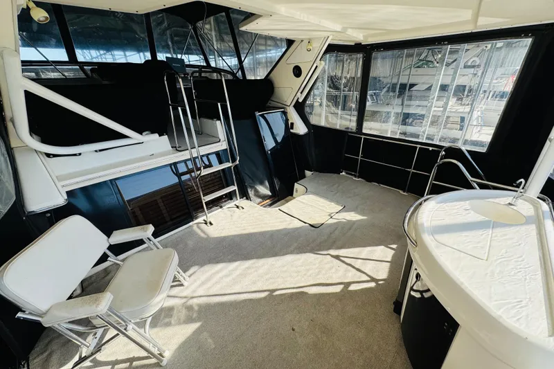 Slide: The Image of Spacious interior of 1995 Bayliner 4587 Motoryacht with seating and windows. - 13