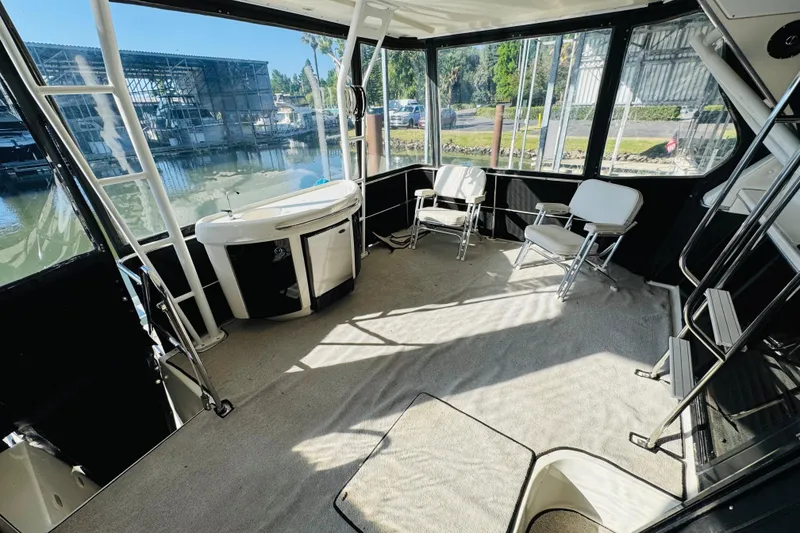 Slide: The Image of Spacious interior of 1995 Bayliner 4587 Motoryacht with seating and water view. - 14