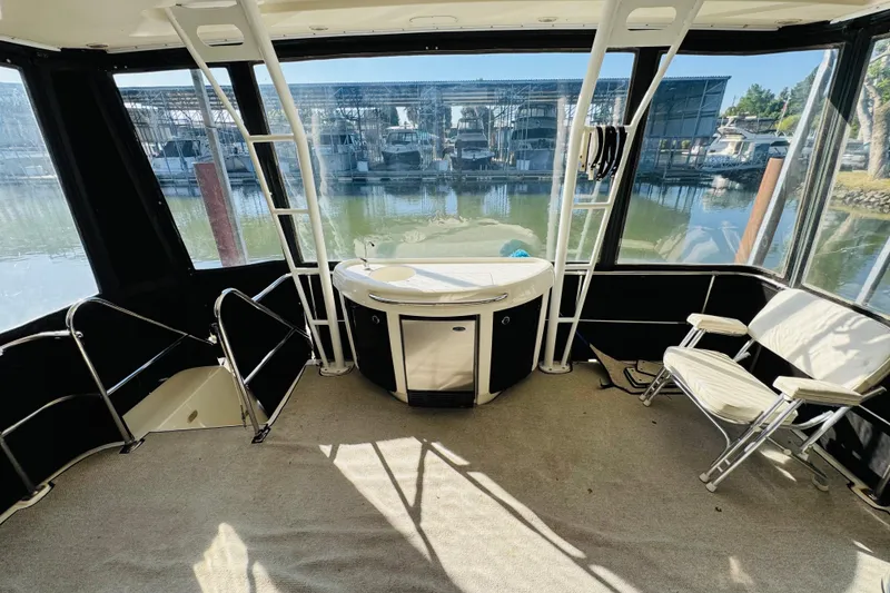 Slide: The Image of 1995 Bayliner 4587 Motoryacht interior with seating and water view. - 15