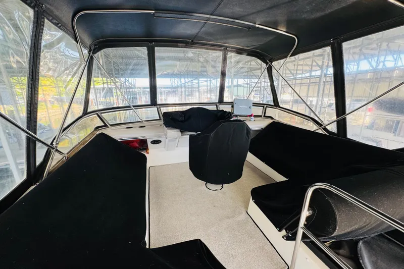 Slide: The Image of Interior view of 1995 Bayliner 4587 Motoryacht helm with seating and navigation equipment. - 18