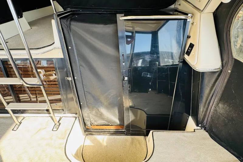 Slide: The Image of 1995 Bayliner 4587 Motoryacht interior with stairs and glass door. - 24