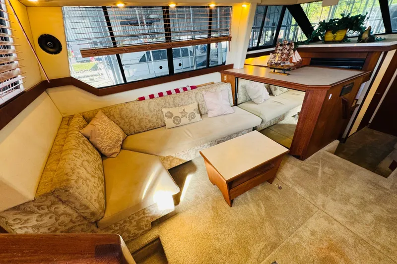 Slide: The Image of Luxurious interior of a 1995 Bayliner 4587 Motoryacht with elegant seating and decor. - 26