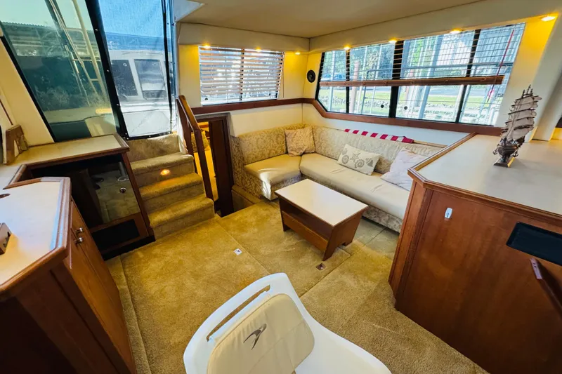 Slide: The Image of Luxurious interior of 1995 Bayliner 4587 Motoryacht with cozy seating and elegant decor. - 28
