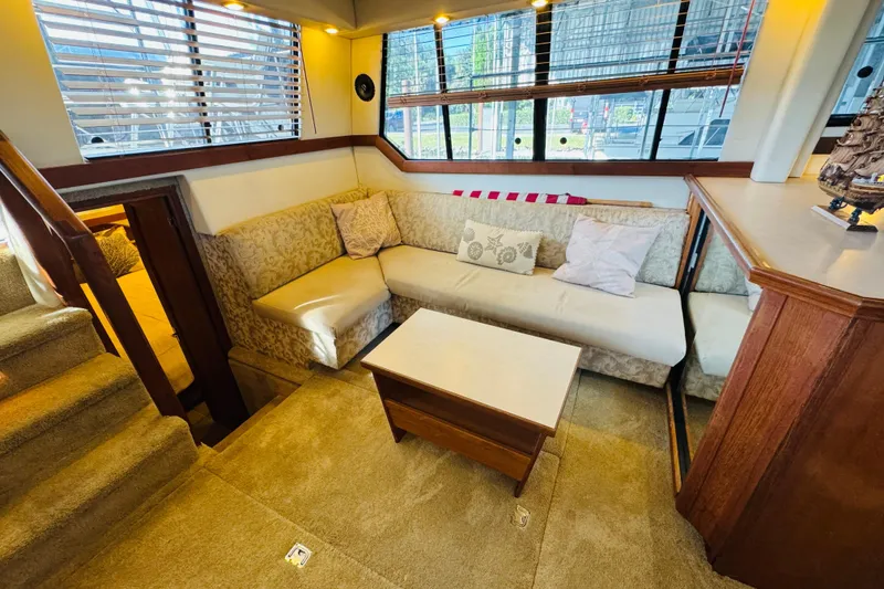 Slide: The Image of Luxurious interior of 1995 Bayliner 4587 Motoryacht with plush seating and elegant decor. - 29