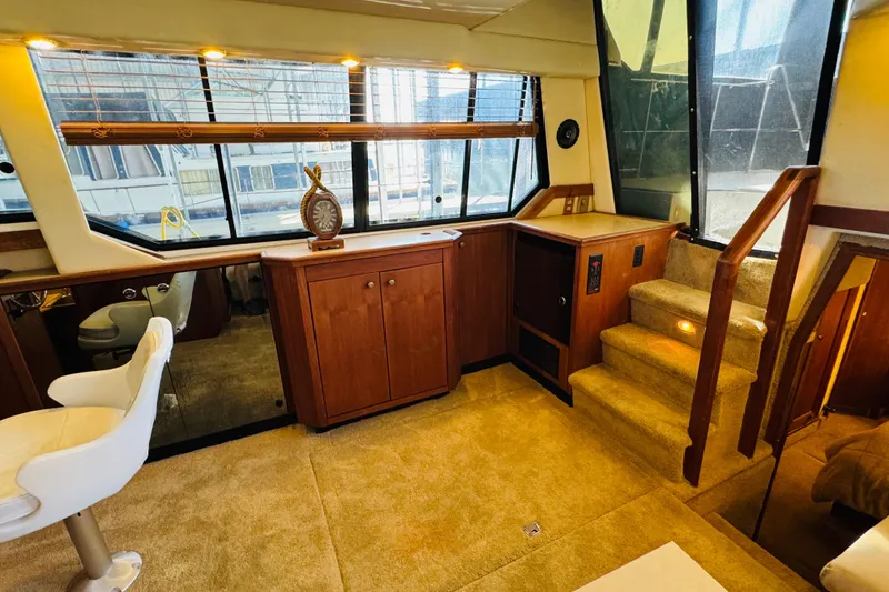 Slide: The Image of Interior of 1995 Bayliner 4587 Motoryacht with wooden cabinetry and carpeted stairs. - 30