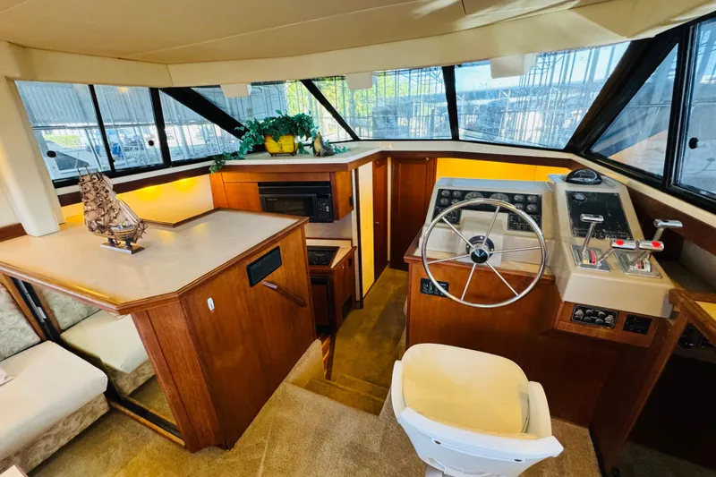 Slide: The Image of Interior of 1995 Bayliner 4587 Motoryacht with helm, seating, and decor. - 31