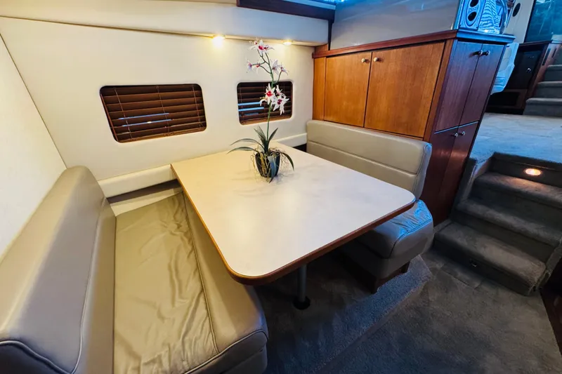 Slide: The Image of Interior of 1995 Bayliner 4587 Motoryacht with cozy dining area and elegant decor. - 37
