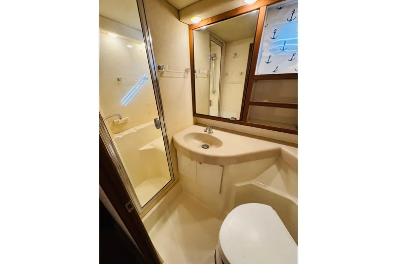 Slide: The Image of Bathroom interior of 1995 Bayliner 4587 Motoryacht with shower, sink, and mirror. - 41