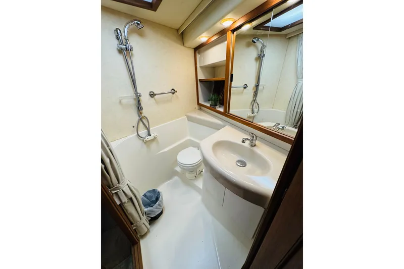 Slide: The Image of Bathroom interior of 1995 Bayliner 4587 Motoryacht with shower, sink, and mirror. - 45