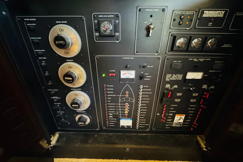 Slide: The Image of Control panel of a 1995 Bayliner 4587 Motoryacht, featuring various switches and gauges. - 46