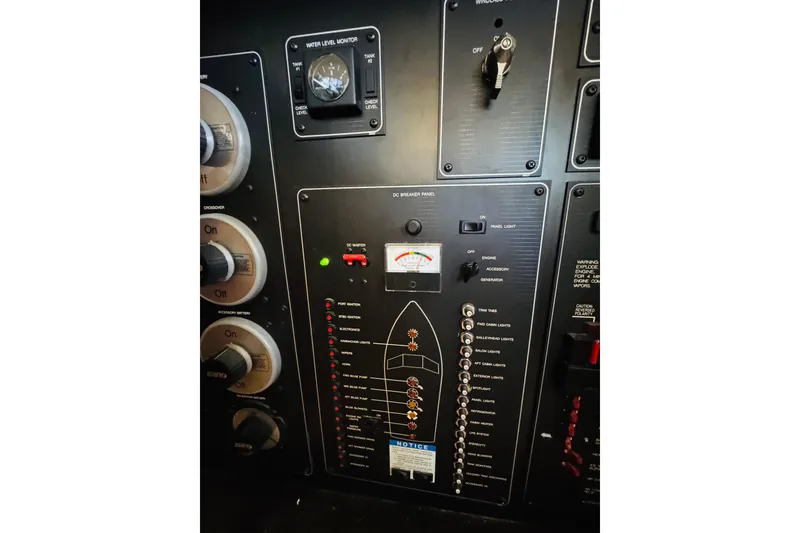 Slide: The Image of Control panel of a 1995 Bayliner 4587 Motoryacht with switches and gauges. - 48