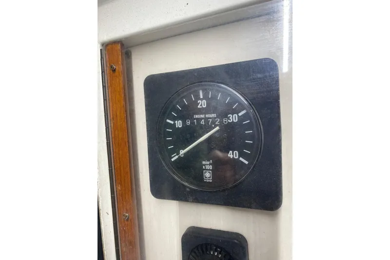 Slide: The Image of Tachometer of 1986 Kadey-Krogen 42 displaying engine hours and RPM. - 15