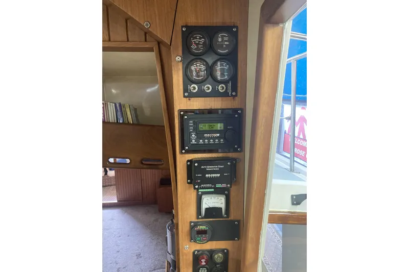 Slide: The Image of Control panel of a 1986 Kadey-Krogen 42 boat with gauges and meters. - 19