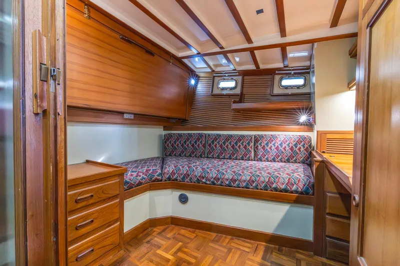 Slide: The Image of Cozy cabin interior of 1986 Kadey-Krogen 42 yacht with wood finish and patterned seating. - 22