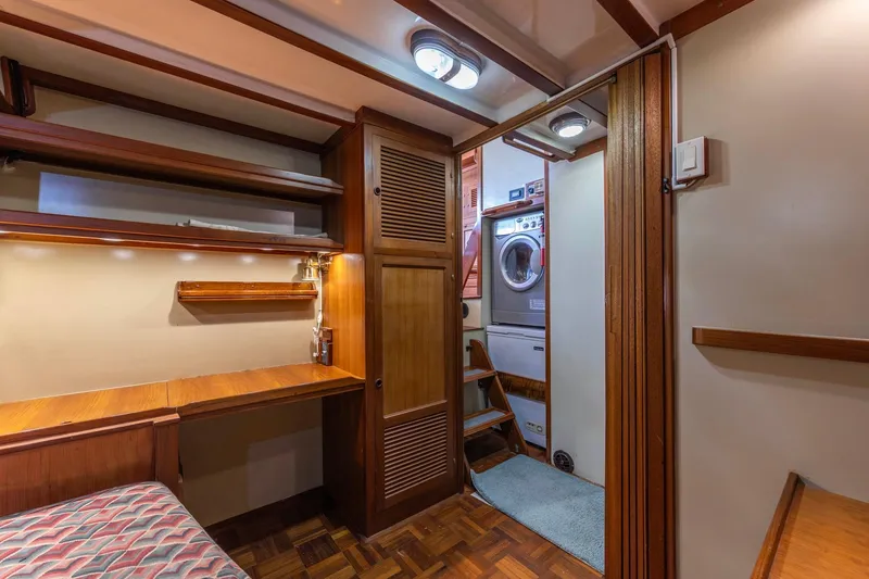 Slide: The Image of Interior of 1986 Kadey-Krogen 42 yacht with wooden desk, shelves, and laundry area. - 23
