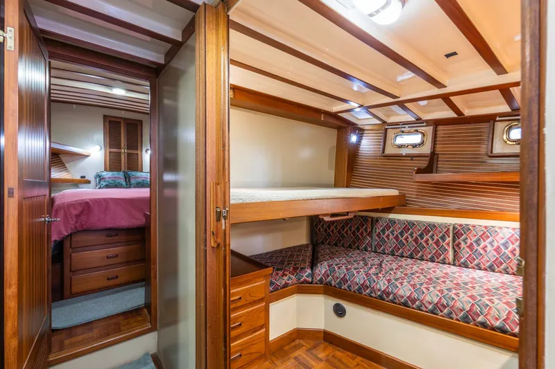 Slide: The Image of 1986 Kadey-Krogen 42 yacht interior with cozy wooden cabin and bunk beds. - 24