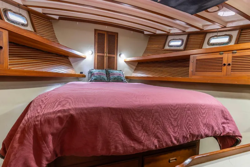 Slide: The Image of Cozy cabin interior of 1986 Kadey-Krogen 42 yacht with wooden accents and comfortable bedding. - 25
