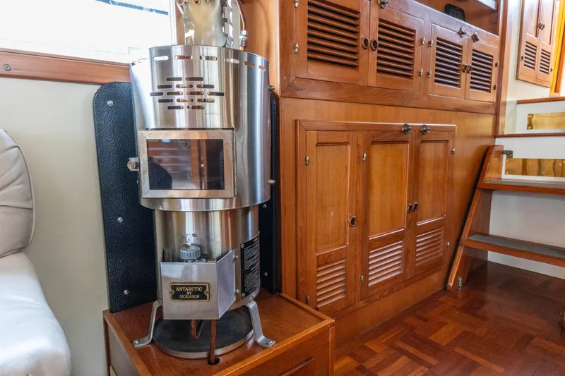 Slide: The Image of 1986 Kadey-Krogen 42 interior with wood cabinetry and Dickinson Antarctic heater. - 3