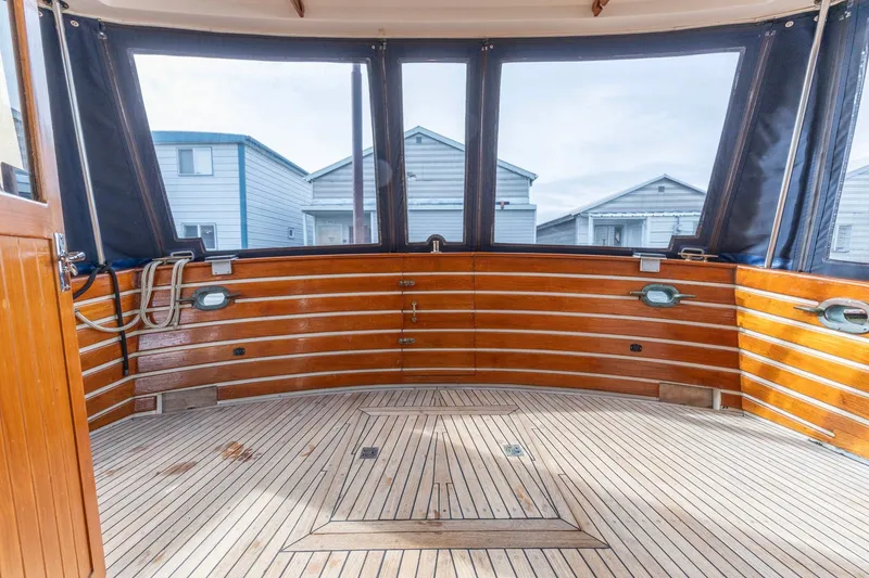 Slide: The Image of Interior view of 1986 Kadey-Krogen 42 boat with wooden deck and windows. - 31