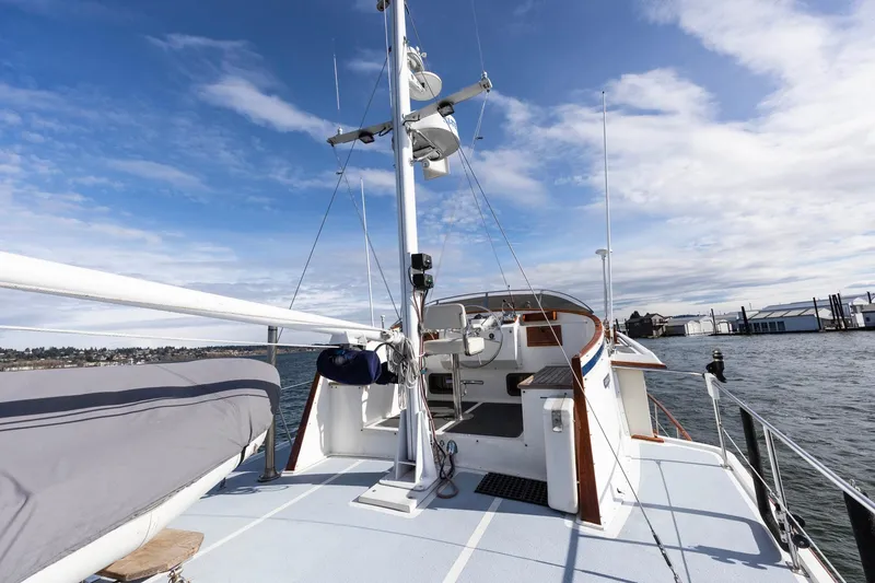 Slide: The Image of 1986 Kadey-Krogen 42 yacht deck with clear sky and waterfront view. - 32