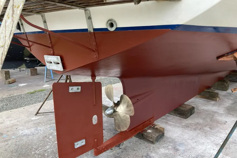 Slide: The Image of 1986 Kadey-Krogen 42 boat hull and propeller on dry dock. - 44