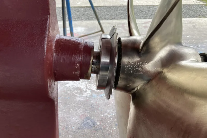 Slide: The Image of Close-up of a 1986 Kadey-Krogen 42 propeller and shaft assembly in a workshop. - 45