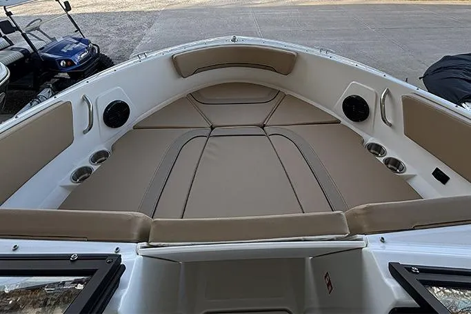 Slide: The Image of 2026 Bayliner V20i boat cockpit with steering wheel and beige captain's chair. - 14