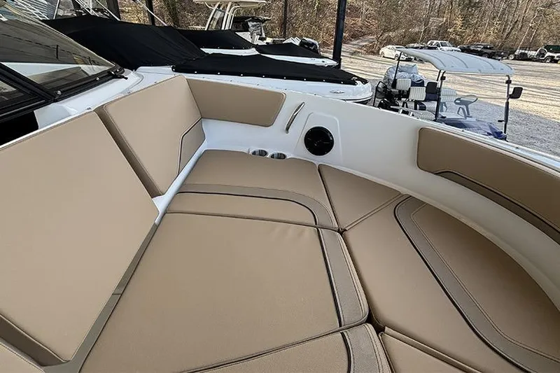 Slide: The Image of 2026 Bayliner V20i boat cockpit with steering wheel and comfortable captain's chair. - 15
