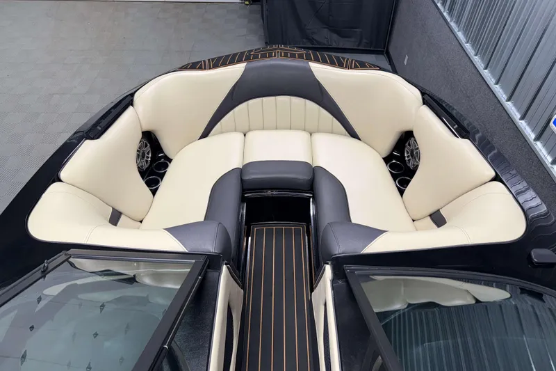 Slide: The Image of 2021 MB B52 23 Classic boat interior with cream and black seating, sleek design. - 13