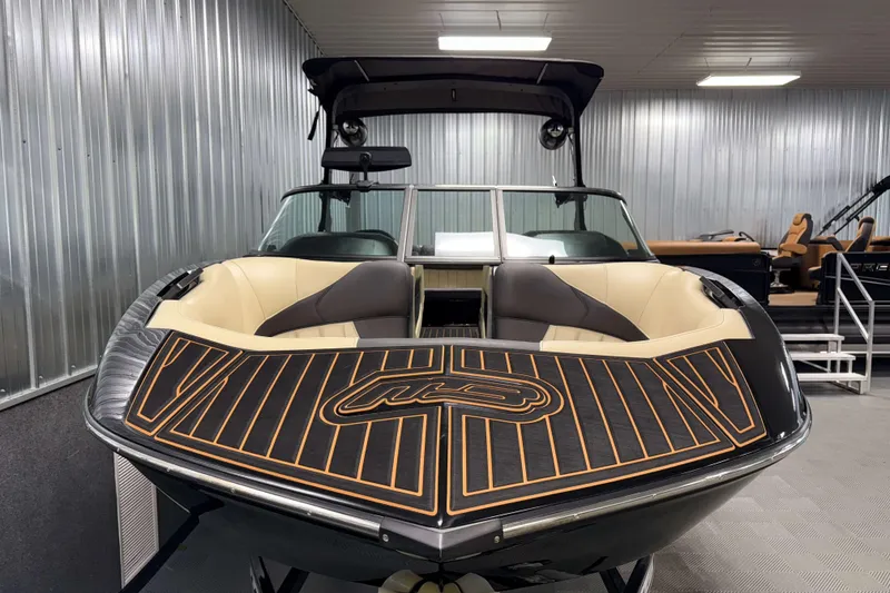 Slide: The Image of 2021 MB B52 23 Classic boat with sleek design in a showroom setting. - 17