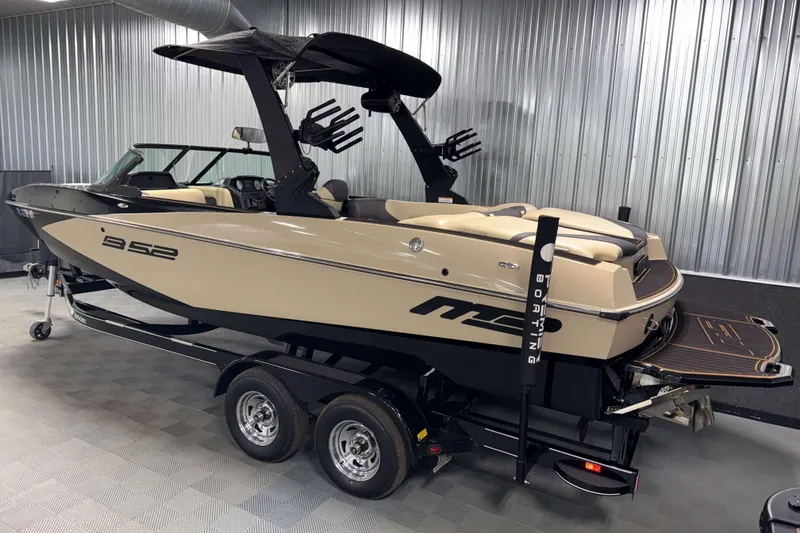 Slide: The Image of 2021 MB B52 23 Classic boat in showroom, beige and black design, on trailer. - 19