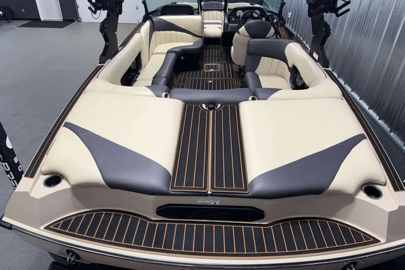 Slide: The Image of 2021 MB B52 23 Classic boat interior with beige and black seating, sleek design. - 2