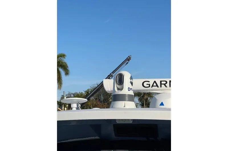 Slide: The Image of 2023 Pursuit S 428 Sport boat with advanced radar and camera equipment. - 14