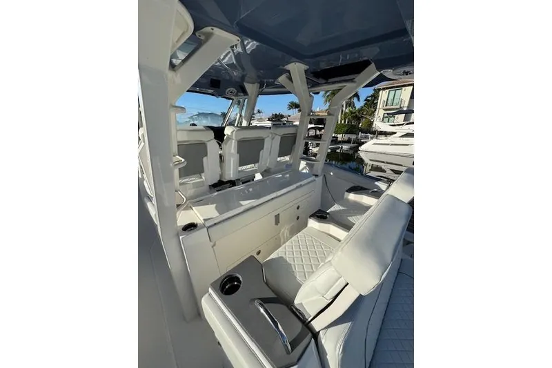 Slide: The Image of 2023 Pursuit S 428 Sport boat interior with luxurious seating and modern design. - 5