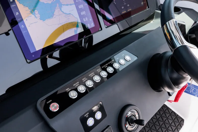 Slide: The Image of 2026 Axopar 29 CCX dashboard with navigation screens and control panel. - 14