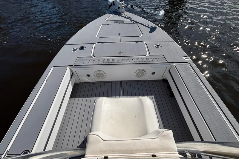 Slide: The Image of 2008 Release Tarpon Bay boat deck with seating, on calm water. - 4