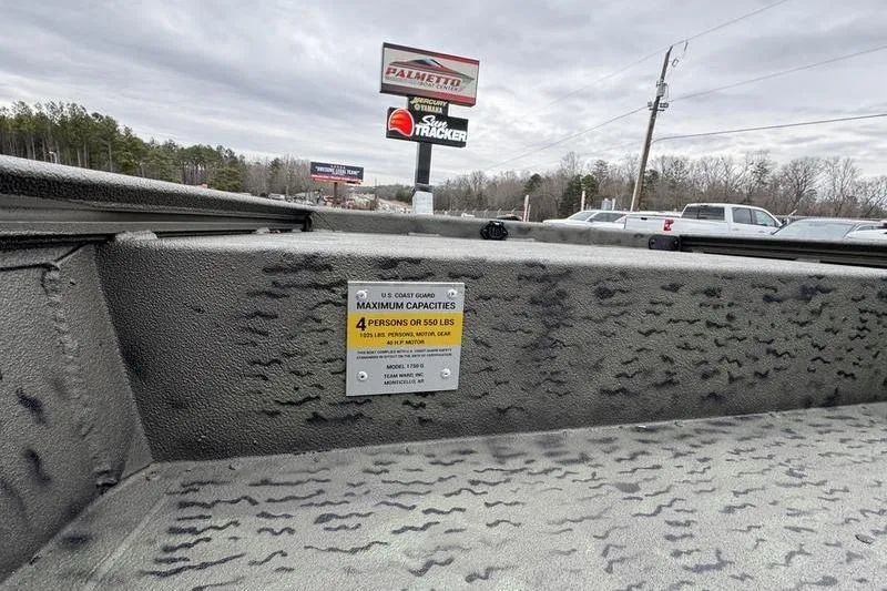 Slide: The Image of War Eagle 750 Gladiator boat, 2026 model, capacity label, outdoor dealership setting. - 5