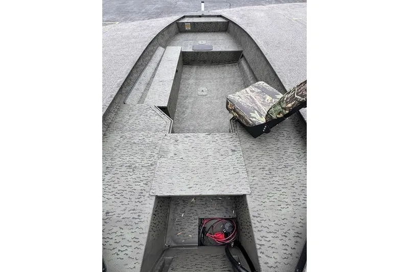Slide: The Image of Interior of 2026 War Eagle 750 Gladiator boat with camouflage seating. - 9