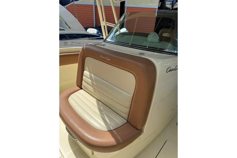 Slide: The Image of 2012 Chris-Craft Catalina 29 boat seat with tan and cream upholstery. - 11