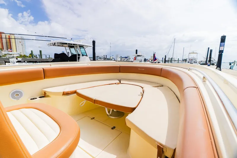 Slide: The Image of 2012 Chris-Craft Catalina 29 Sun Tender with luxurious seating at a marina. - 15
