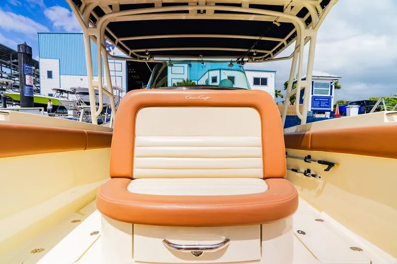 Slide: The Image of 2012 Chris-Craft Catalina 29 Sun Tender boat interior with tan seating and sleek design. - 16