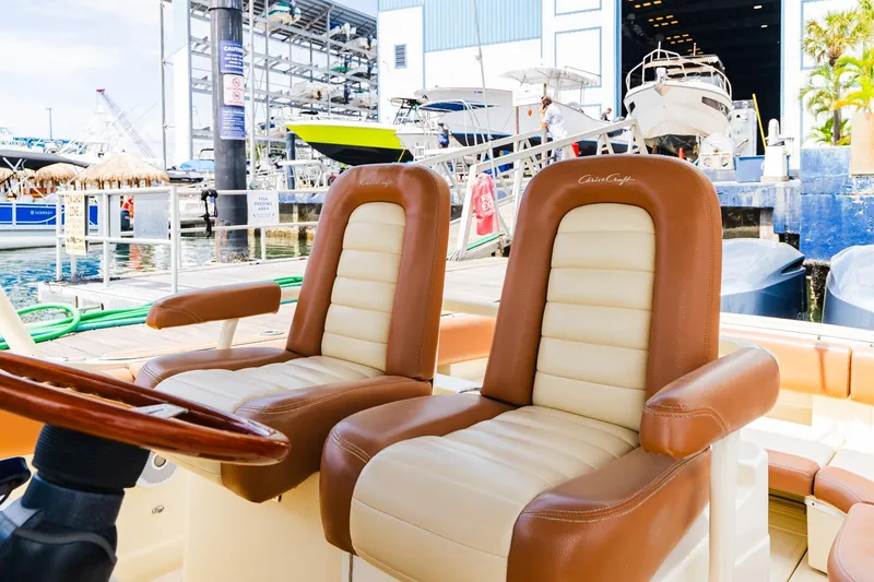 Slide: The Image of 2012 Chris-Craft Catalina 29 Sun Tender with luxurious seating at a marina. - 21